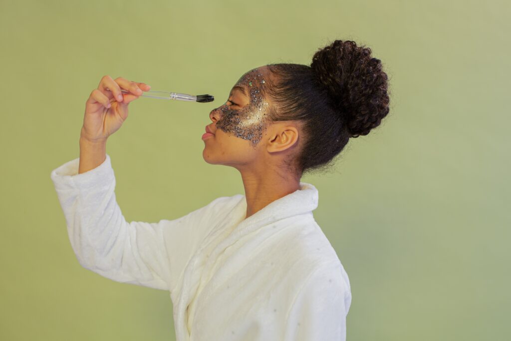 woman applying facial mask